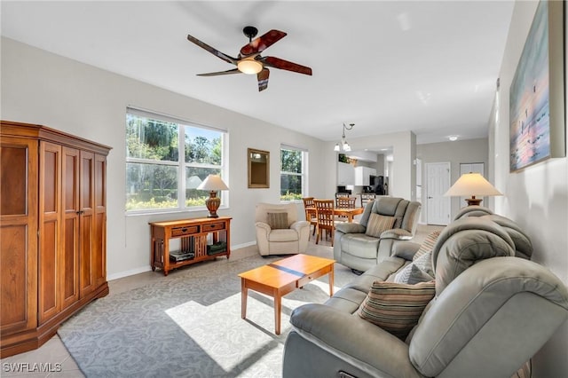 3970 Loblolly Bay Dr Unit 5-108, Naples, FL 34114 - living room featuring a ceiling fan and baseboards