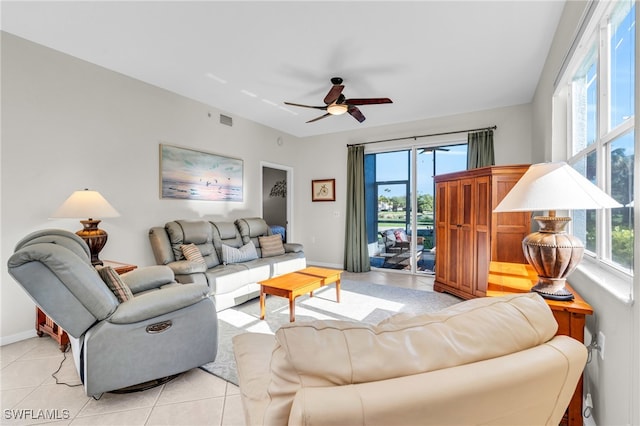 tiled living room featuring ceiling fan