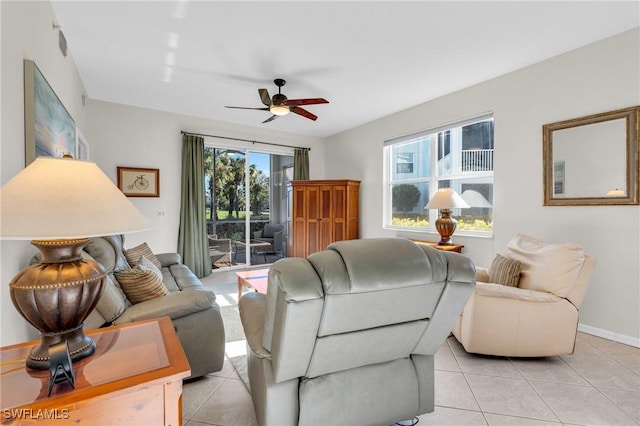 3970 Loblolly Bay Dr Unit 5-108, Naples, FL 34114 - living room featuring ceiling fan, light tile patterned flooring, and baseboards