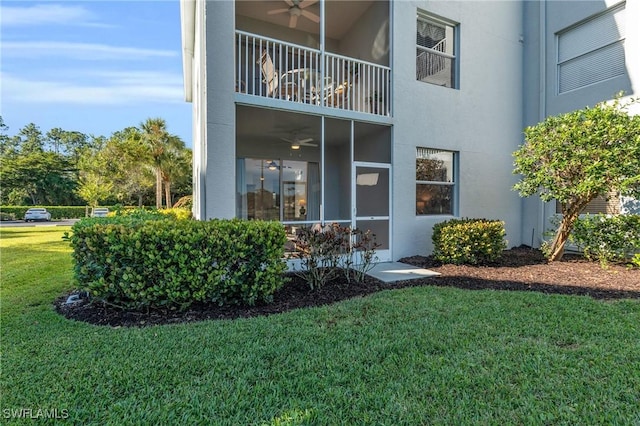 3970 Loblolly Bay Dr Unit 5-108, Naples, FL 34114 - entrance to property featuring ceiling fan, a yard, stucco siding, and a balcony