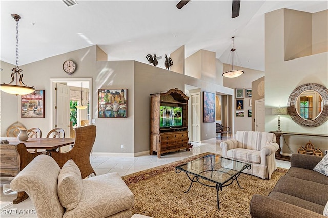 living area featuring a ceiling fan, high vaulted ceiling, baseboards, and light tile patterned floors