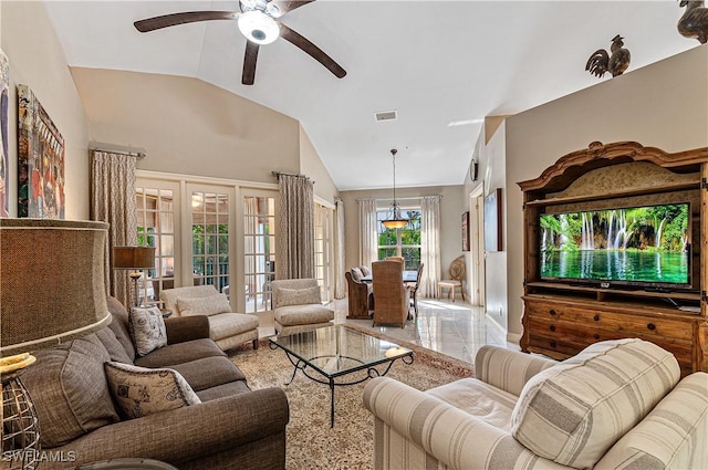 living area with french doors, marble finish floor, visible vents, a ceiling fan, and vaulted ceiling