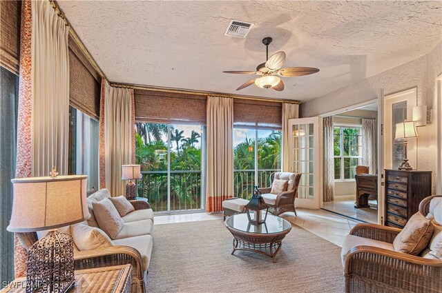 sunroom / solarium with ceiling fan