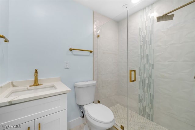 bathroom with walk in shower, vanity, and toilet