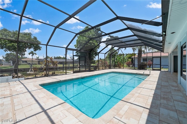 view of swimming pool with a lanai and a patio