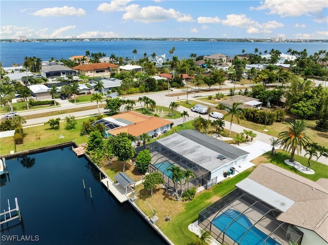 birds eye view of property featuring a water view