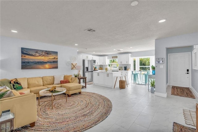 living room featuring a textured ceiling