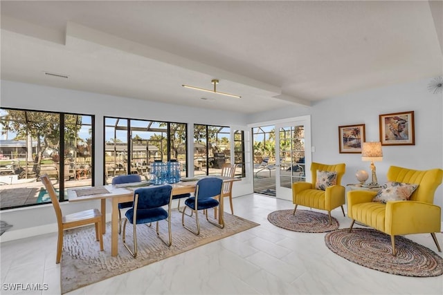 dining area featuring plenty of natural light