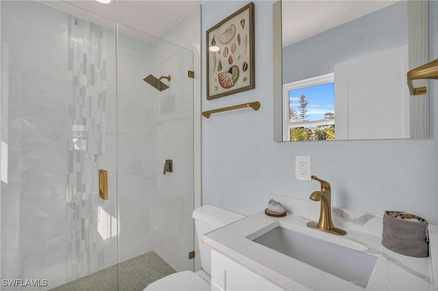 bathroom featuring walk in shower, vanity, and toilet