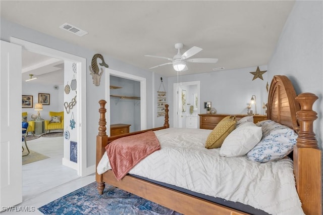 bedroom featuring ceiling fan and a closet