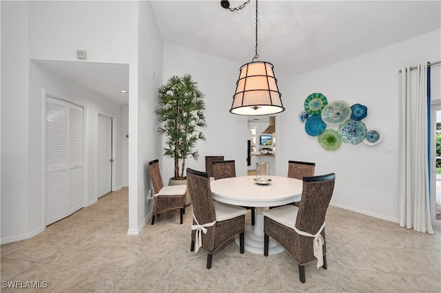 dining space featuring light tile patterned flooring