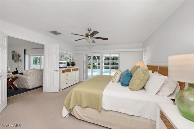 bedroom featuring access to outside, light colored carpet, and ceiling fan