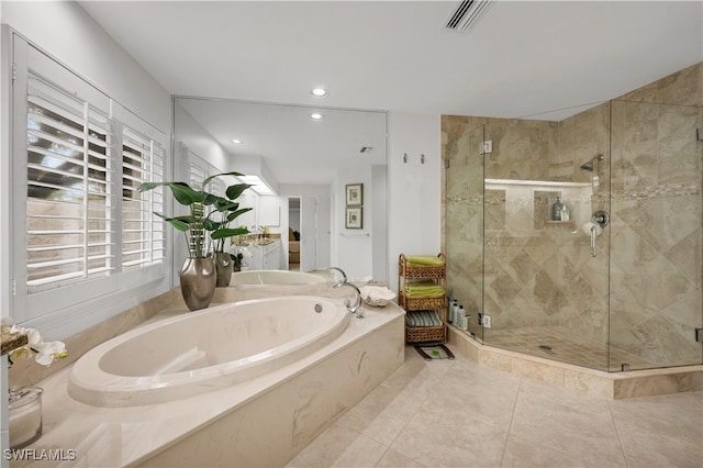 bathroom featuring shower with separate bathtub and tile patterned flooring