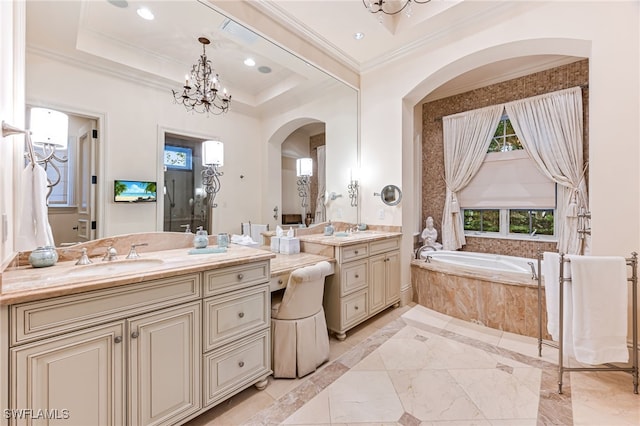 bathroom with a relaxing tiled tub, a notable chandelier, a tray ceiling, vanity, and ornamental molding