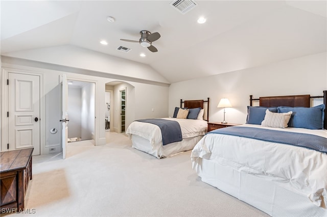 bedroom featuring light carpet, ceiling fan, and vaulted ceiling