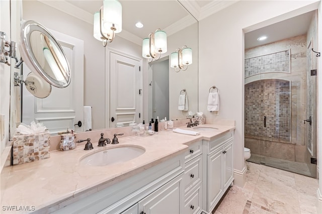 bathroom with vanity, toilet, an enclosed shower, and crown molding