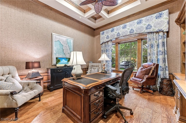 home office featuring ceiling fan, light hardwood / wood-style floors, coffered ceiling, and ornamental molding