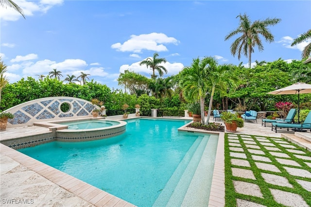 view of pool with an in ground hot tub and a patio