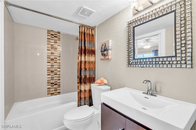 full bathroom with toilet, vanity, shower / bath combo with shower curtain, and ceiling fan