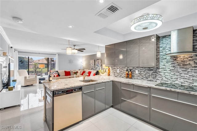 kitchen featuring kitchen peninsula, wall chimney exhaust hood, stainless steel dishwasher, gray cabinets, and black electric stovetop