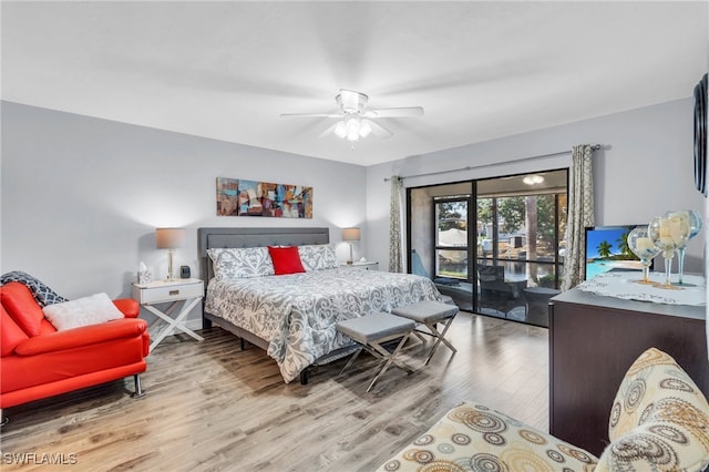 bedroom featuring ceiling fan, light wood-type flooring, and access to outside