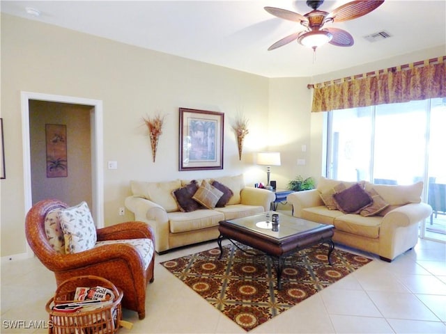 living room with ceiling fan and light tile patterned floors