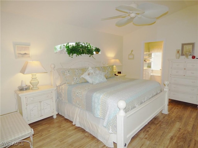 bedroom featuring ceiling fan, wood-type flooring, and connected bathroom