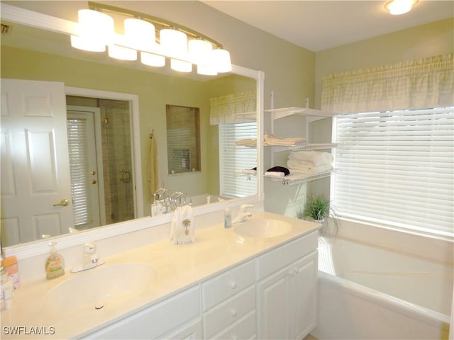 bathroom featuring shower with separate bathtub and vanity