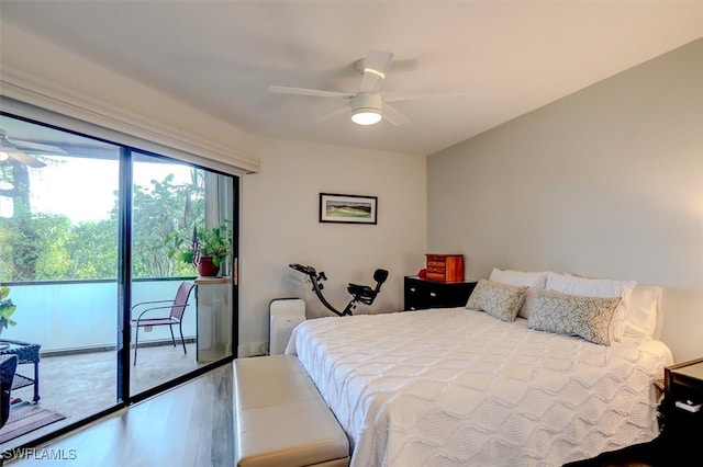 bedroom with access to exterior, wood-type flooring, and ceiling fan