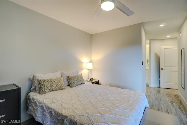 bedroom featuring ceiling fan and wood-type flooring