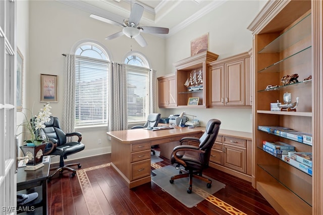 office space with ornamental molding, dark wood-type flooring, and ceiling fan