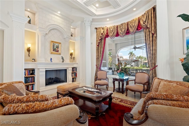 living area with a fireplace, coffered ceiling, crown molding, and a towering ceiling