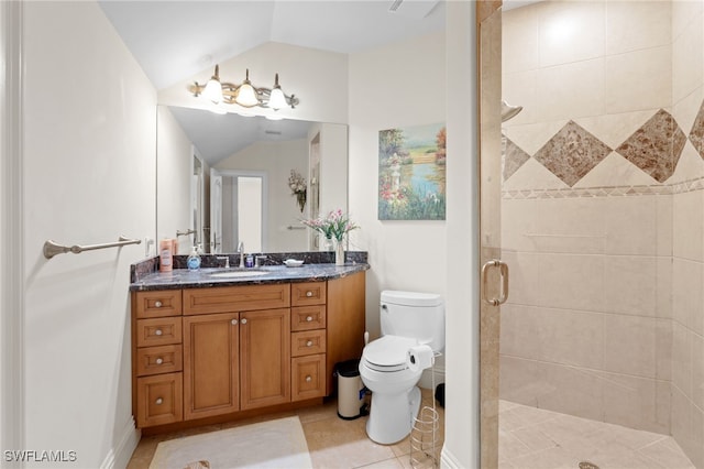 bathroom with vanity, a shower with shower door, tile patterned floors, toilet, and vaulted ceiling