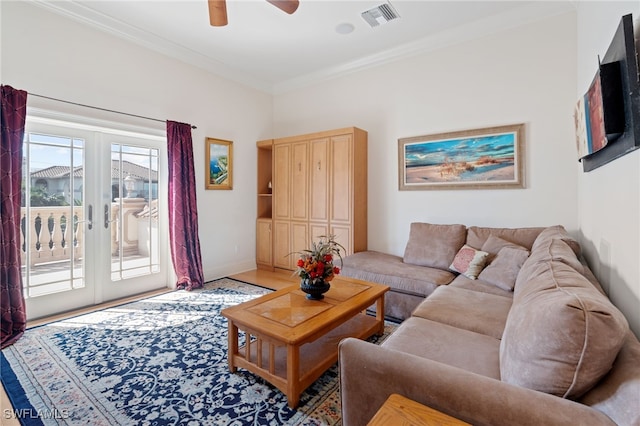 living room with french doors, wood-type flooring, ceiling fan, and crown molding