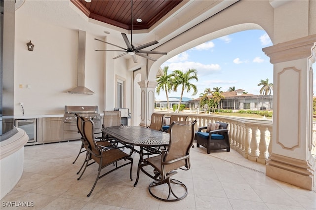 view of patio / terrace featuring grilling area, beverage cooler, an outdoor kitchen, and ceiling fan