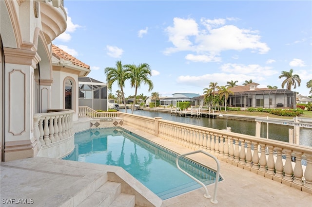 view of swimming pool with a water view