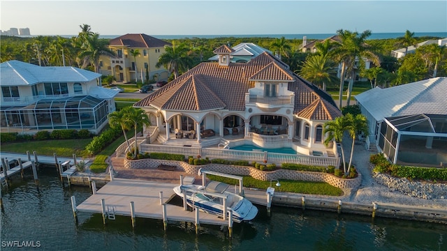 back of house featuring a patio area and a water view