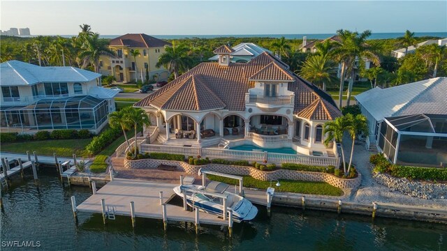 509 Spinnaker Dr, Marco Island, FL 34145 - rear view of property with a water view, a tile roof, an outdoor pool, boat lift, and a patio area