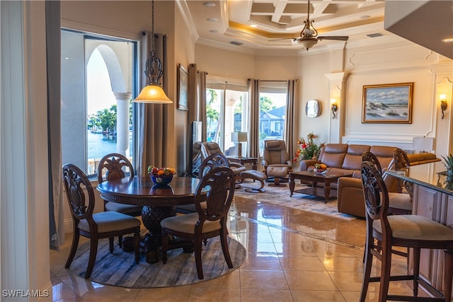 dining room with a high ceiling, ceiling fan, beam ceiling, crown molding, and coffered ceiling