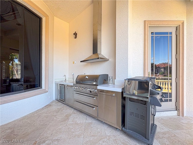 view of patio / terrace featuring area for grilling and sink