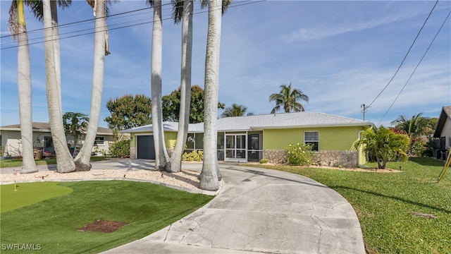 view of front of house with a front lawn and a garage