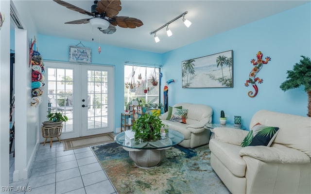 sitting room featuring french doors, light tile patterned floors, ceiling fan, and rail lighting