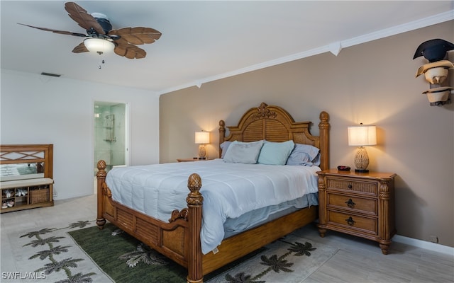 bedroom with ceiling fan, connected bathroom, light hardwood / wood-style flooring, and ornamental molding