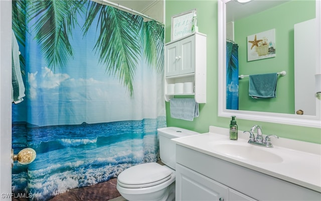 bathroom featuring vanity and toilet