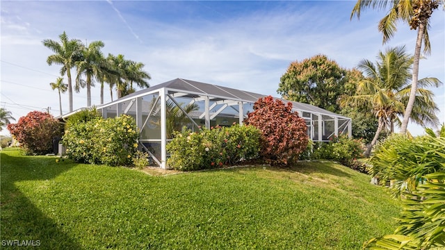 view of yard with glass enclosure