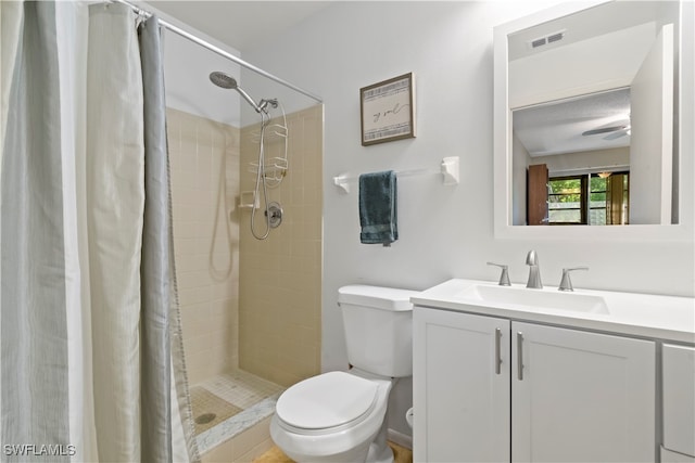 bathroom with toilet, a shower with curtain, and vanity