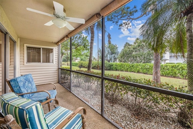 sunroom / solarium featuring ceiling fan and plenty of natural light