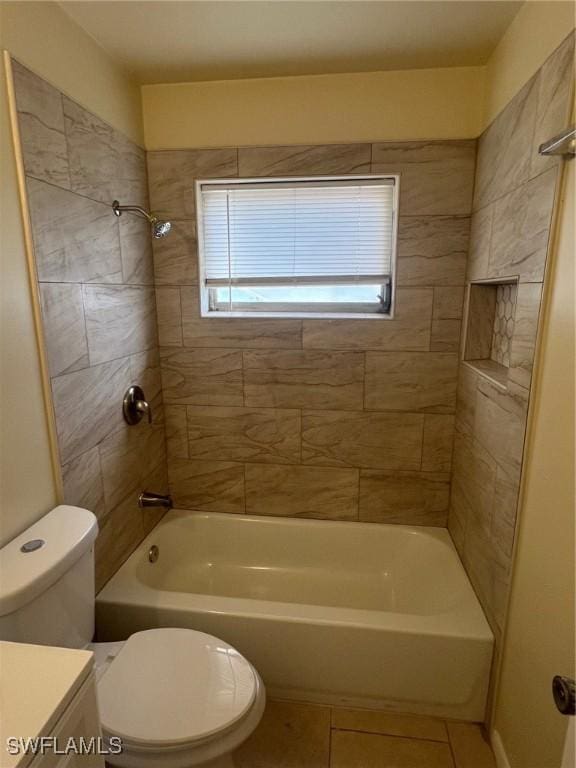 full bathroom with tile patterned floors, toilet, vanity, and tiled shower / bath