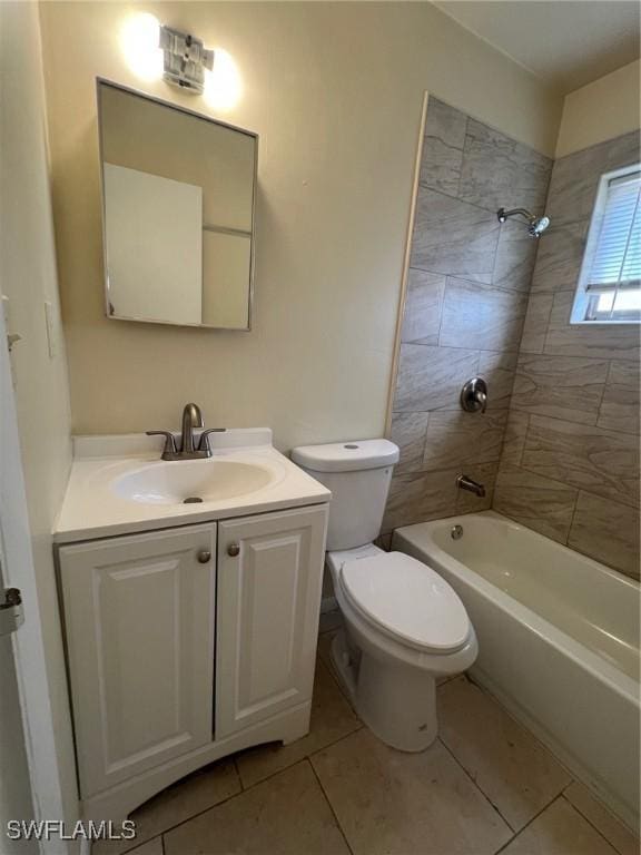 full bathroom featuring tile patterned floors, toilet, vanity, and tiled shower / bath