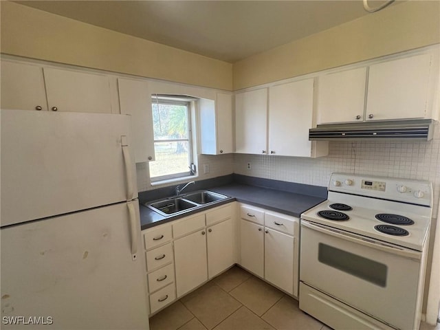 kitchen with white cabinetry, sink, light tile patterned floors, and white appliances